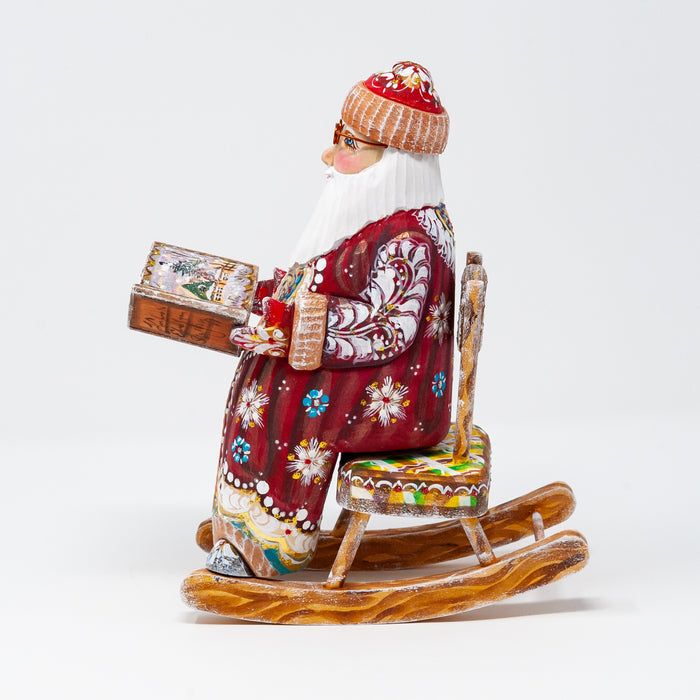 Hand-carved   Grandfather Frost in a Rocking Chair with a Book